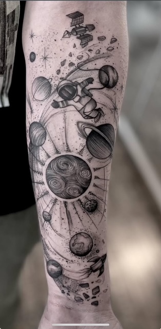 black work space astronaut tattoo